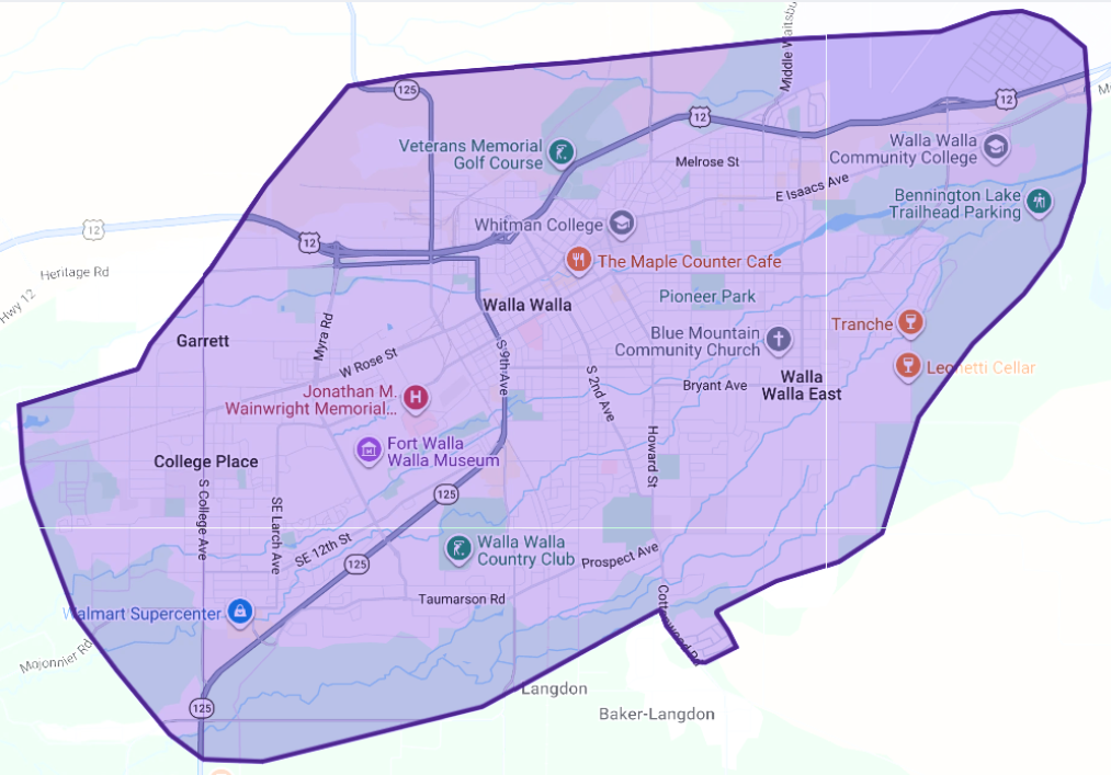 Map of the Walla Walla area with a large, irregular purple-outlined boundary and transparent purple shading. The boundary includes central Walla Walla, College Place, Walla Walla East, Whitman College, Walla Walla Community College, the Veterans Memorial Golf Course, Walla Walla Country Club, and nearby neighborhoods. The map uses a darker, higher-contrast purple outline and overlay while retaining visible streets and landmarks.